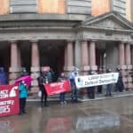 Action Report: Defend Democracy Coalition Rallied Despite the Rain