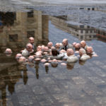 A sculpture by Isaac Cordal--Follow the leaders. It depicts global leaders as balding men of European descent groping around in water (the rising sea) up to their chests.