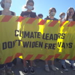 Youth climate activists with banner: Climate Leaders Don't Widen Freeways